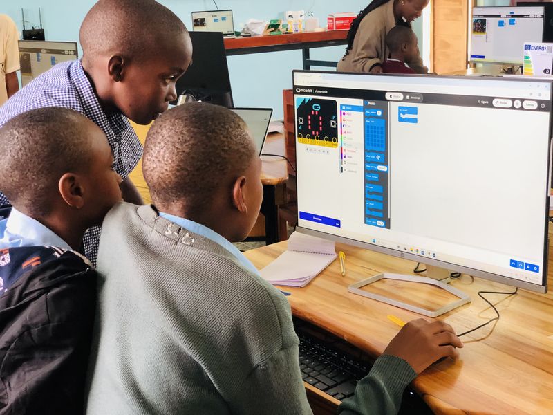 Students working together on a micro:bit lesson